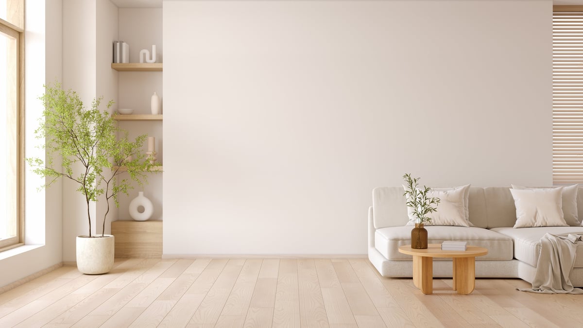 Minimal living room with modern sofa and coffee table with wooden flooring